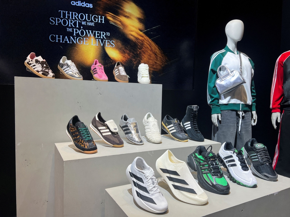 Adidas products are displayed at the company headquarters in Herzogenaurach, Germany March 5, 2025. The German sportswear giant said Wednesday it took a hit from US tariffs in the second quarter but did not indicate whether it would pass on rising costs to consumers. — Reuters pic 