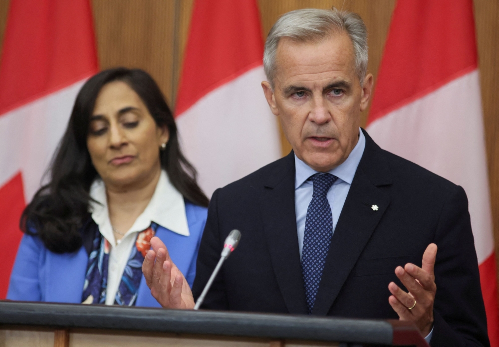 Canada’s Prime Minister Mark Carney speaks at a press conference about recognising Palestinian statehood while Foreign Affairs Minister Anita Anand listens, in Ottawa, Ontario, Canada, July 30, 2025. — Reuters pic 