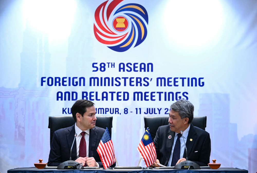 US Secretary of State Marco Rubio and Malaysian Foreign Minister Datuk Seri Mohamad Hasan sign a memorandum of understanding during the 58th Asean Foreign Ministers’ Meeting and related events at the Kuala Lumpur Convention Centre, July 10, 2025. — Reuters pic