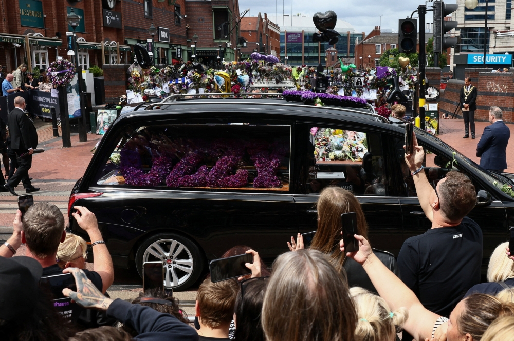 Thousands of heavy metal fans lined the streets of Birmingham on Wednesday for the funeral procession of Black Sabbath frontman Ozzy Osbourne, who died earlier this month at the age of 76. — Reuters pic