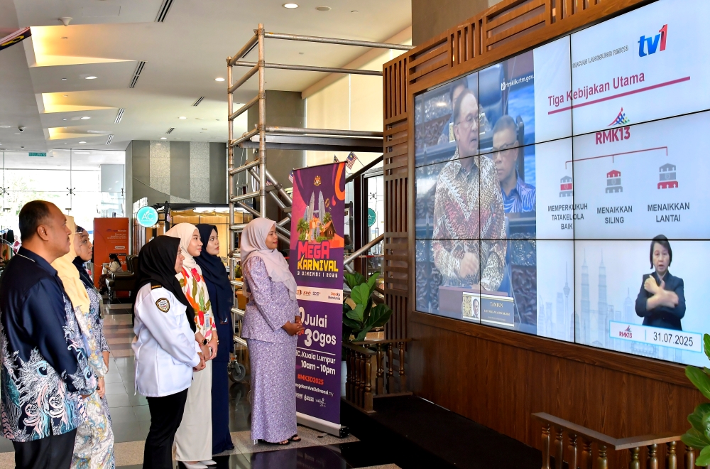 Civil servants watch the live broadcast of the presentation of the 13th Malaysia Plan (RMK13) by Prime Minister Datuk Seri Anwar Ibrahim during a Bernama survey July 31, 2025. — Bernama pic