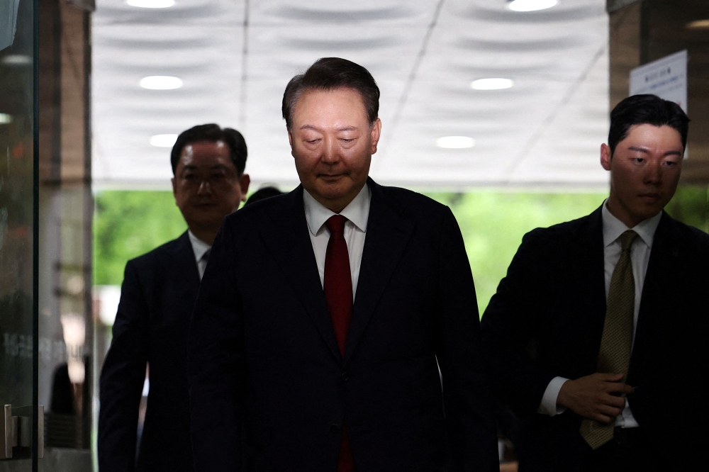 Former South Korean President Yoon Suk Yeol arrives at a court to attend a hearing to review his arrest warrant requested by special prosecutors in Seoul, South Korea, in this file picture dated July 9, 2025. — Reuters pic 