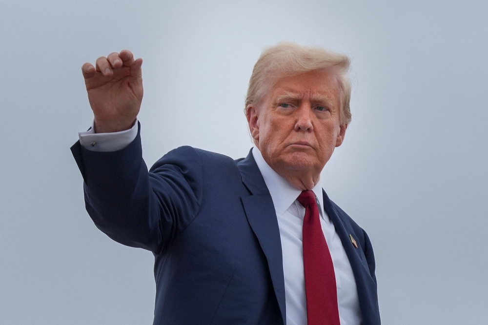 US President Donald Trump boards Air Force One on his way to New Jersey from Joint Base Andrews, Maryland, August 1, 2025. — Reuters pic