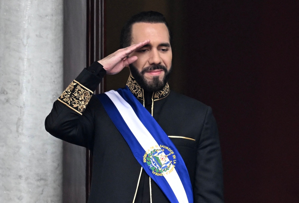 El Salvador's President Nayib Bukele salutes during the military parade after being sworn in at the National Palace in downtown San Salvador June 1, 2024. — AFP pic