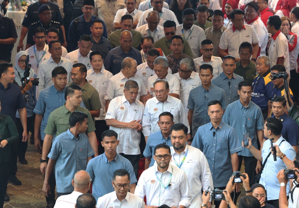 Prime Minister Datuk Seri Anwar Ibrahim visits an exhibition booth at the launch of the 2025 National Farmers, Breeders and Fishermen’s Day (HPPNK) in Kota Kinabalu August 3, 2025, accompanied by Agriculture and Food Security Minister Datuk Seri Mohamad Sabu. — Bernama pic 