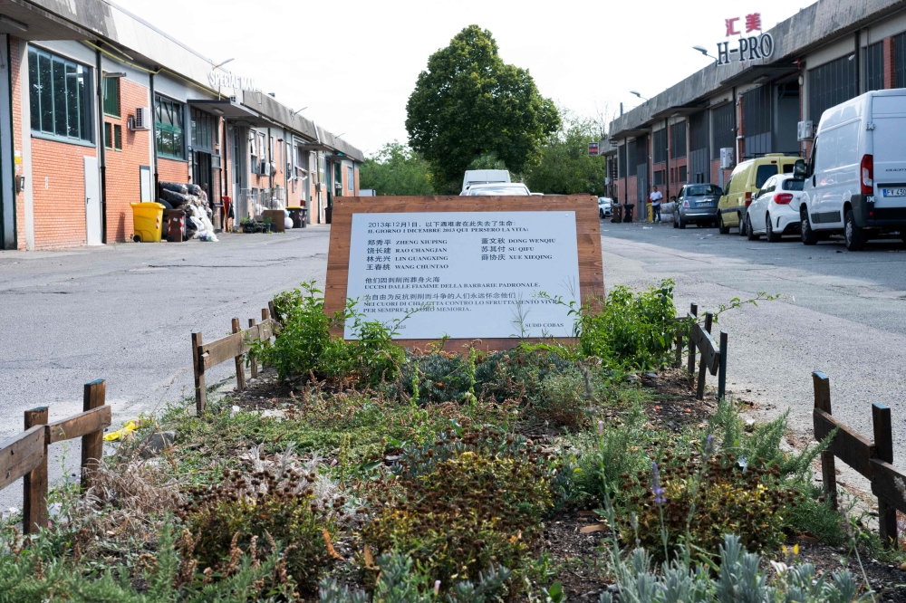 This photograph shows a commemorative plaque at the site where seven Chinese workers died in a fire on December 2013, in the industrial district in Prato, central Italy, on August 1, 2025. — AFP pic