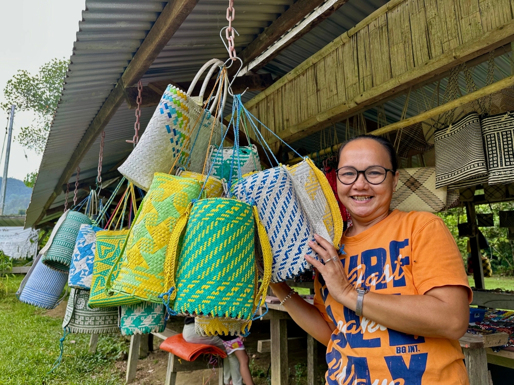 Julie Nyeling, 46, is a craftswoman at the Mulu Handicraft Market in Kampung Batu Bungan. — Bernama pic