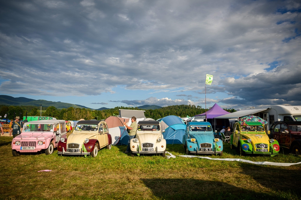 Citroen 2CV vehicles are parked at a camp during the 25th World Meeting of 2CV Friends in Postojna, Slovenia. — AFP pic
