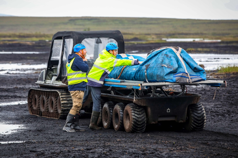 Chief Pilot Padraic Doherty and intern Jacob Hamilton prepare to launch one the Kitepower Kites at their launch site at Bangor Erris, Ireland on July 18 2025. — AFP pic
