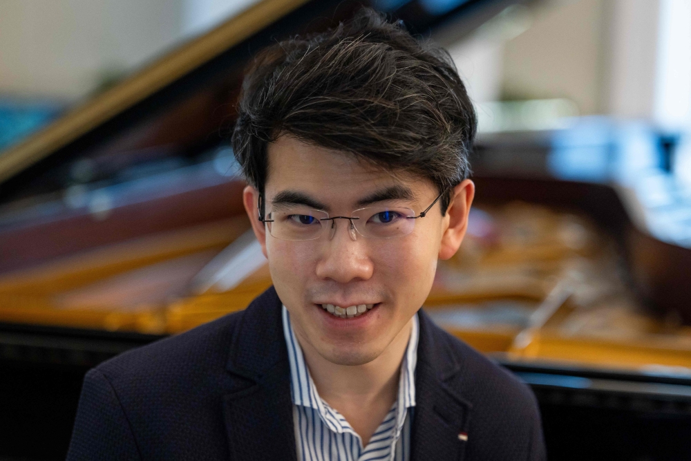Aristo Sham, 29, from Honk Kong, winner of the 2025 Van Cliburn Competition, pose for the pictures after rehearsal session before his concert on the second day of the 80th Duszniki International Chopin Piano Festival in Duszniki Zdroj, southwestern Poland, August 2, 2025. — AFP pic