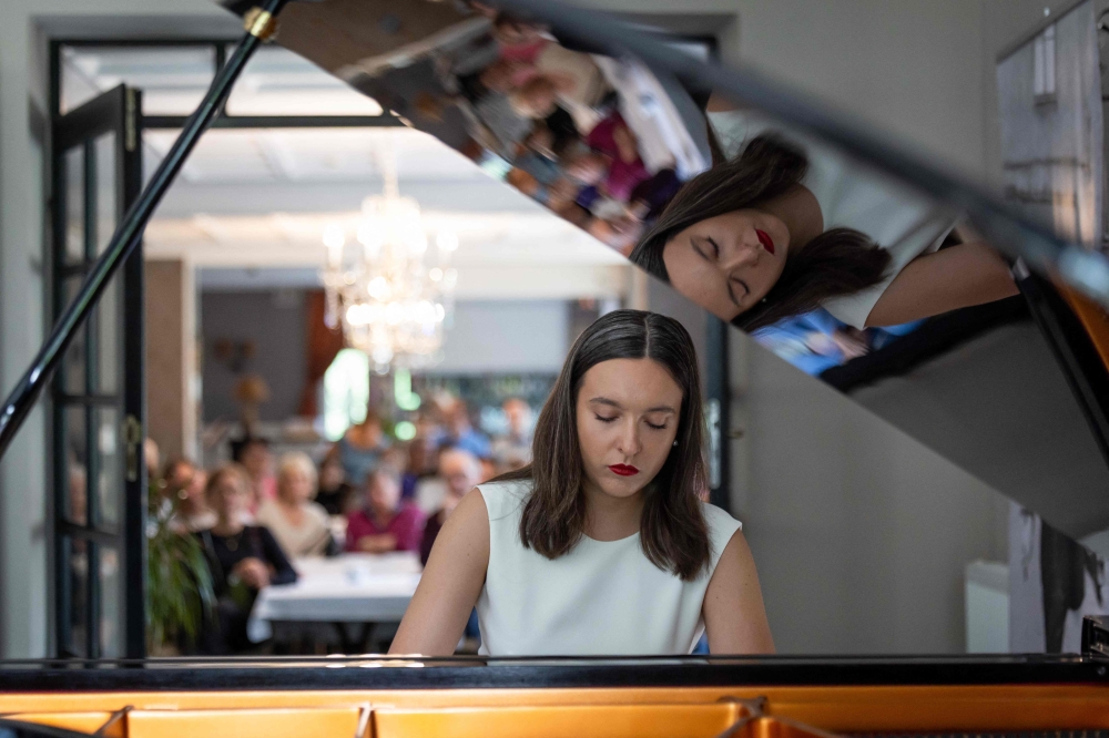 Julia Lozowska, 23, Warsaw-born pianist, plays piano during her concert on the second day of the 80th Duszniki International Chopin Piano Festival in Duszniki Zdroj, southwestern Poland, August 2, 2025. — AFP pic