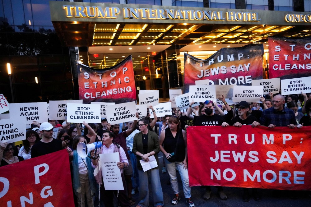 Protestors block the road outside of Trump International Hotel during a rally against the hunger crisis in Gaza that organizers say is caused by Israel, in New York City, U.S., August 4, 2025. — Reuters pic