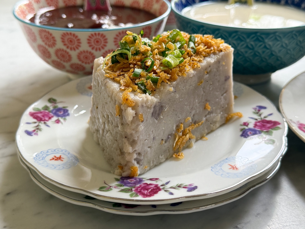 Yam Cake is substantial with tiny bits of taro and an aromatic topping of fried dried prawns and fried shallots. — Picture by Lee Khang Yi