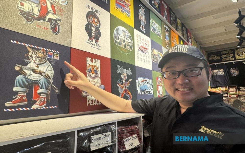 What makes their business even more unique is that most of the designs for their T-shirts, mugs, jackets, tote bags and caps are created by their eldest son, Wang Sin Ee, 45. — Picture from X/Bernama 