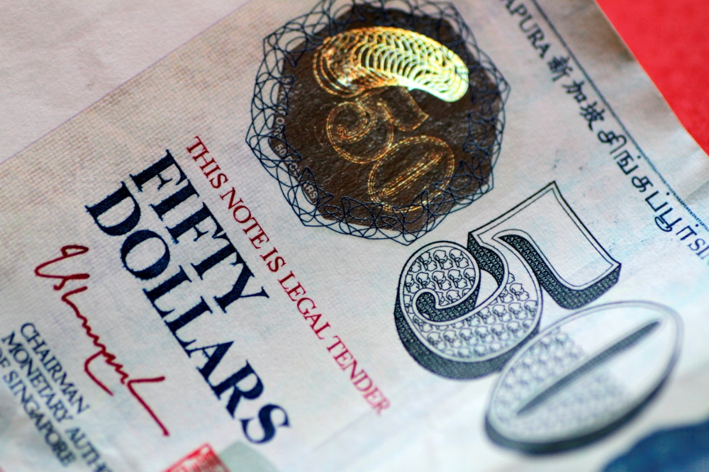 Derrick Yeo Wei Kin, 40, and his father, Yeo Kian Huat, 73, are accused of using shell companies to run sham transactions worth S$181 million to cheat the tax authority. — Reuters pic