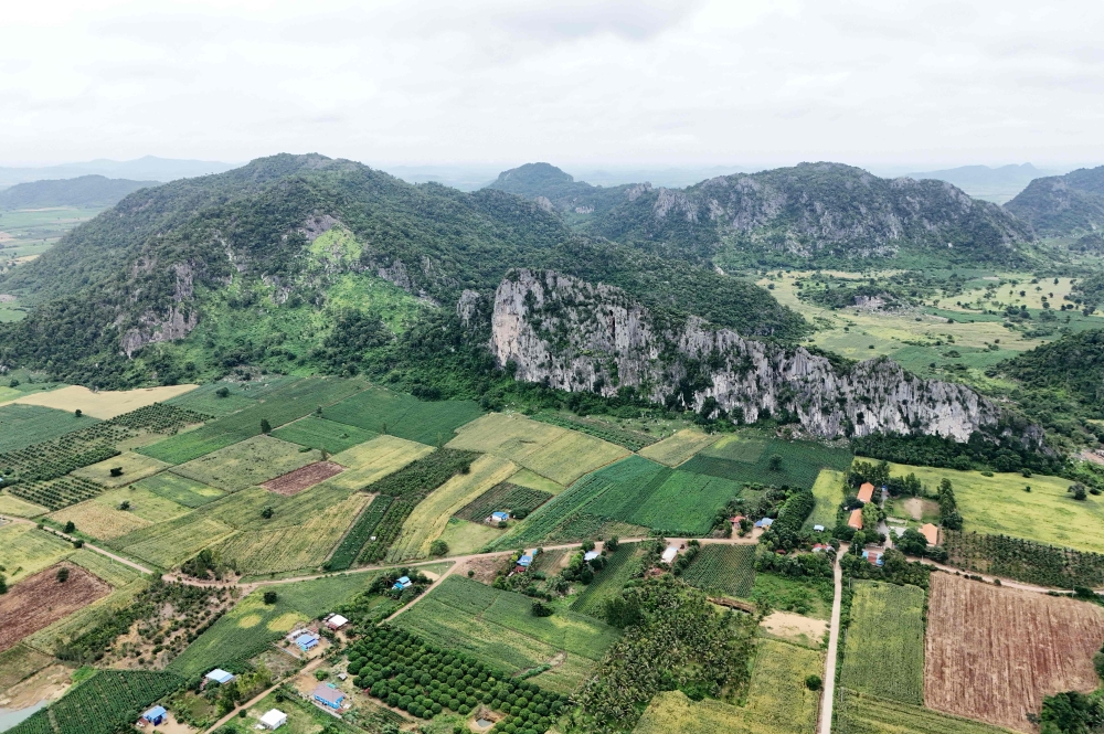 This photo taken on July 22, 2025 shows an aerial view of limestone karst formations where conservationist searched for new species in Phnom Proek district in Battambang province. Rain erosion creates their characteristic fluted, pockmarked exteriors and vast interior caves and tunnels. — AFP pic