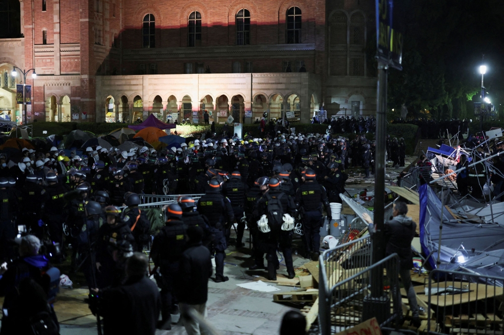 Law enforcement officers stand guard at the University of California Los Angeles (UCLA), during a pro-Palestinian protest in Los Angeles May 2, 2024. — Reuters pic