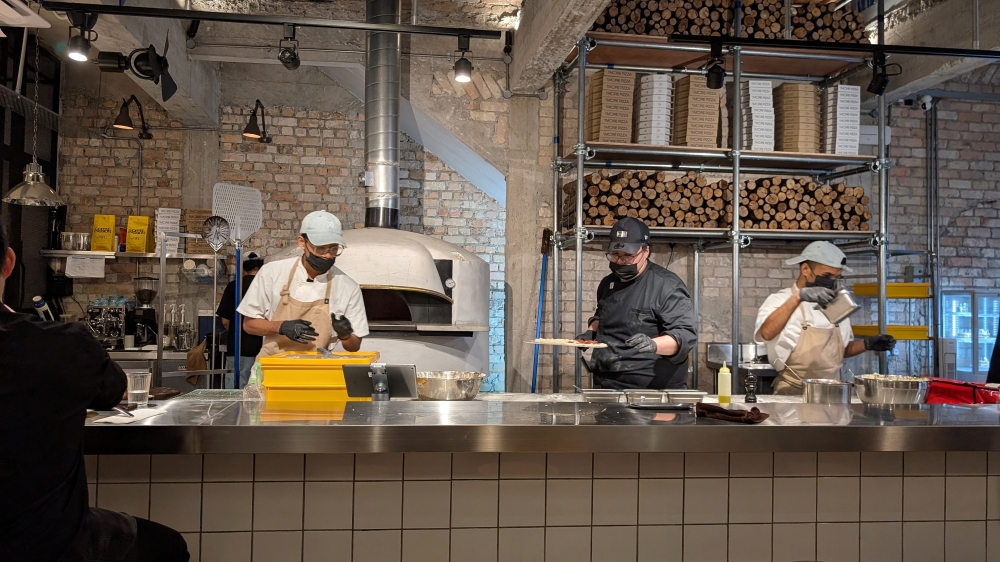 The gas-powered brick oven is the centrepiece of the restaurant. — Picture by Ethan Lau