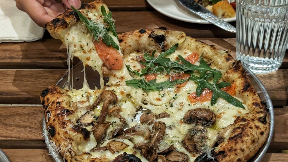 Lucy in The Sky and Smoke on the Water, two flavours at 1MORE Pizza merged into one pizza. — Picture by Ethan Lau