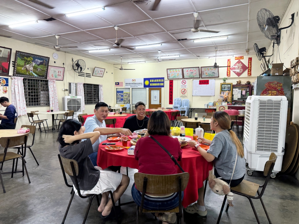 The restaurant also acts as the political party MCA’s local office at one section that is surrounded by fans and portable air conditioners. — Picture by Lee Khang Yi