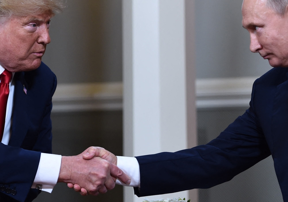 In this file photo taken on July 16, 2018, US President Donald Trump and Russian President Vladimir Putin shake hands ahead a meeting in Helsinki. US President Donald Trump said on August 8, 2025 he would meet with Russian counterpart Vladimir Putin on August 15 in Alaska, as the Republican billionaire hopes to help mediate an end to the war in Ukraine. — AFP pic 