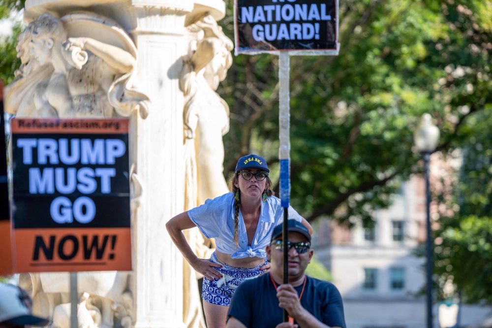 Protesters gather at Dupont Circle after the morning press conference by President Trump on August 11, 2025 in Washington, DC. — Getty Images via AFP pic