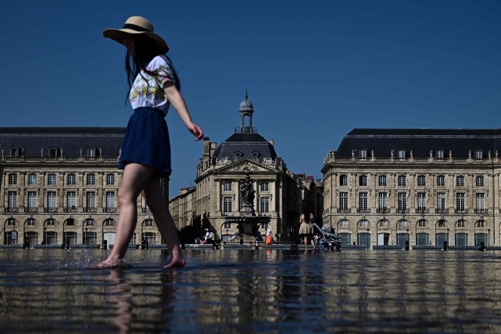 Temperature records were broken at at least four weather stations in southern France yesterday and three-quarters of the country was under heat alerts today, with temperatures forecast to top 36 degrees Celsius in the Paris region and 40 degrees Celsius in the Rhône Valley. — AFP pic