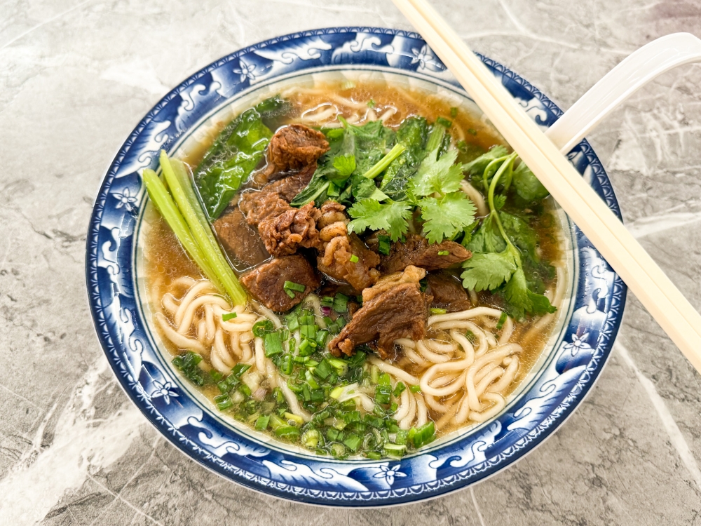For a stronger flavour, the Braised Beef Noodles with Pickled Mustard Greens will have you drinking the soup with the noodles. — Picture by Lee Khang Yi