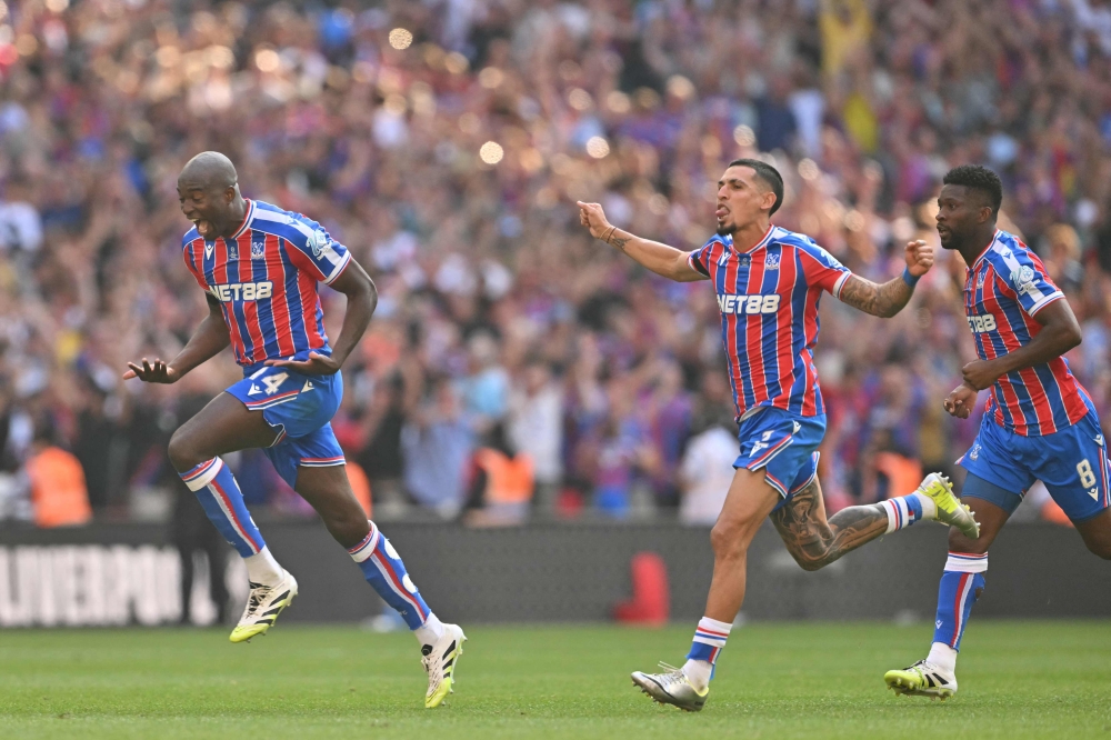 Crystal Palace’s French striker #14 Jean-Philippe Mateta (left), Colombian defender #02 Daniel Munoz (centre) and Colombian midfielder #08 Jefferson Lerma celebrate after winning the shoot-out to win the English FA Community Shield football match between Crystal Palace and Liverpool at Wembley Stadium, in London on August 10, 2025. — AFP pic 