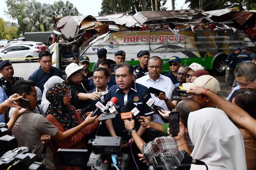 Transport Minister Anthony Loke speaks to reporters while inspecting the bus involved in the accident involving the UPSI students. June 12, 2025. — Bernama pic