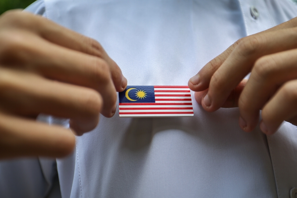 This Merdeka, I raise the Jalur Gemilang as I do every year. I sing Negaraku with my hand on my heart.  — Bernama pic
