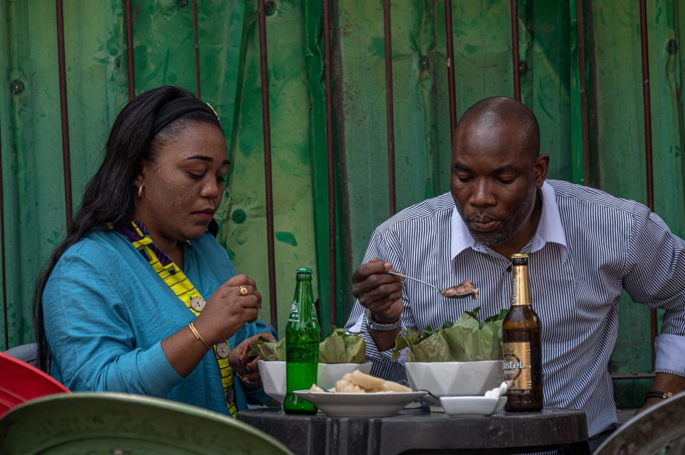 Diners flock to the terrace of Mother Antho Aembe’s restaurant in downtown Kinshasa to enjoy liboke. — AFP pic