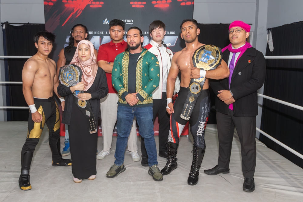 APAC Wrestling founder Ayez Shaukat Fonseka Farid (centre) with fellow wrestlers at the press conference. — Picture by Raymond Manuel