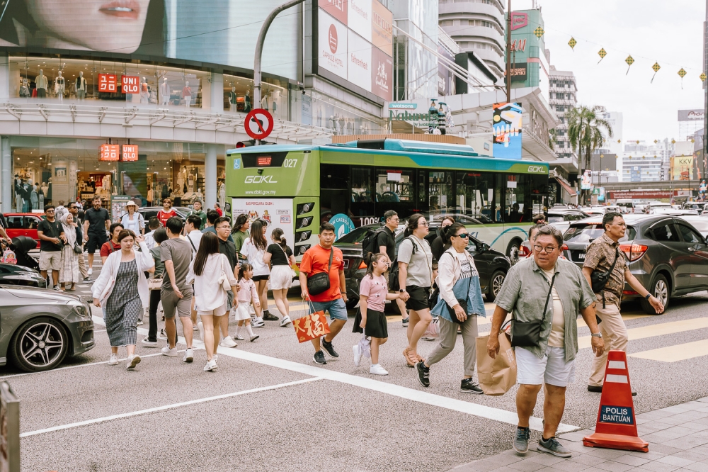 Beneath the neon lights of Bukit Bintang, poverty persists in ways not often obvious. — Picture by Raymond Manuel