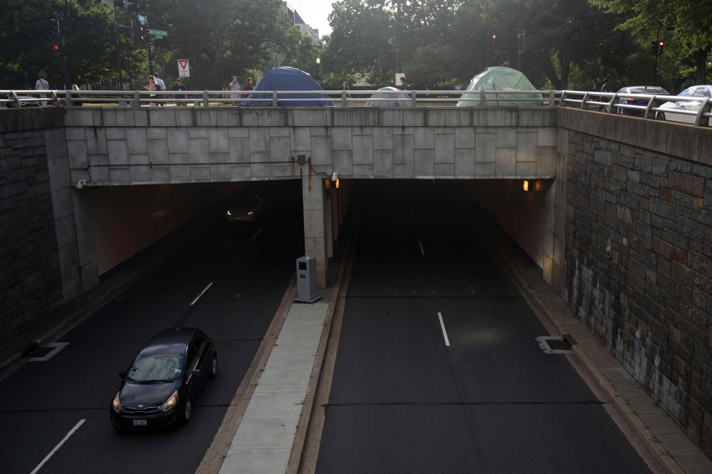 Homeless encampments are seen near Washington Circle in Washington August 14, 2025. — AFP pic