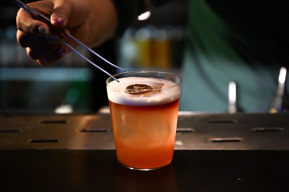 A bartender prepares a drink at Barc, a cocktail bar and restaurant in Kathmandu July 2, 2025. — AFP pic