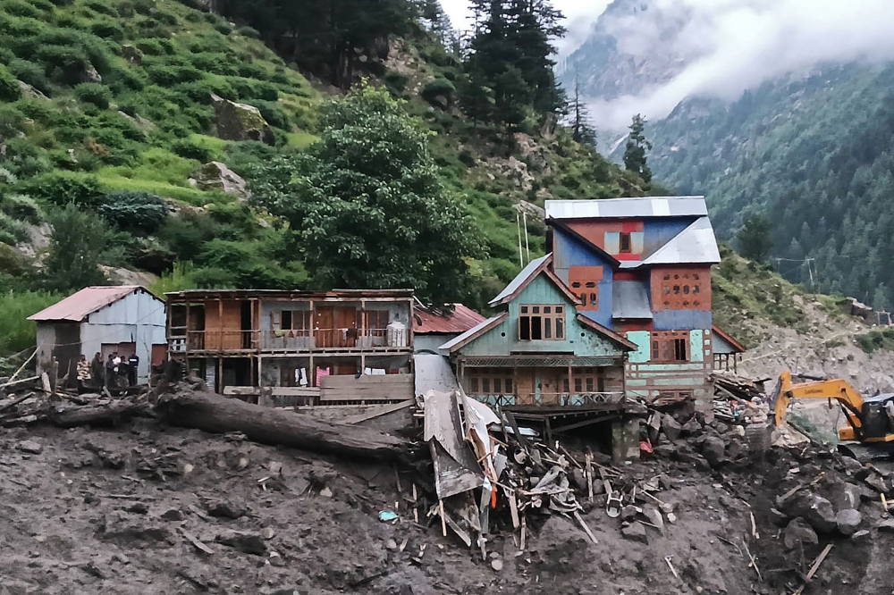 Rescuers inspect the site of a flashflood at a village in Kishtwar district on August 14, 2025. — AFP pic 