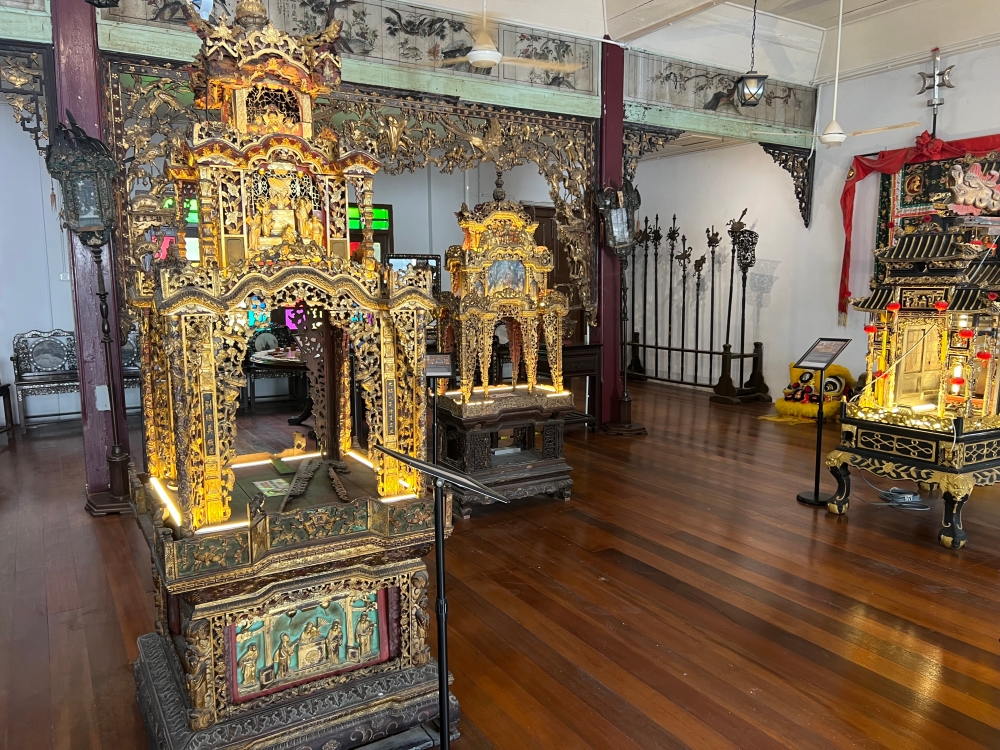 The gilded palanquins to transport the statues of deities during street parades. — Picture by Opalyn Mok