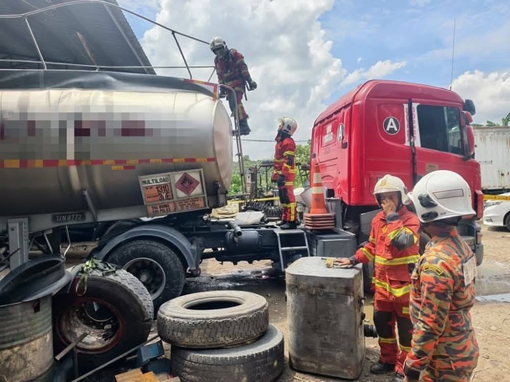 A Hazmat team from the Fire and Rescue Department in Negeri Sembilan is investigating the exact cause behind an exploding truck tank containing Hexane residue that killed the driver and injured his assistant on August 16, 2025. — Picture from Facebook/Seremban page