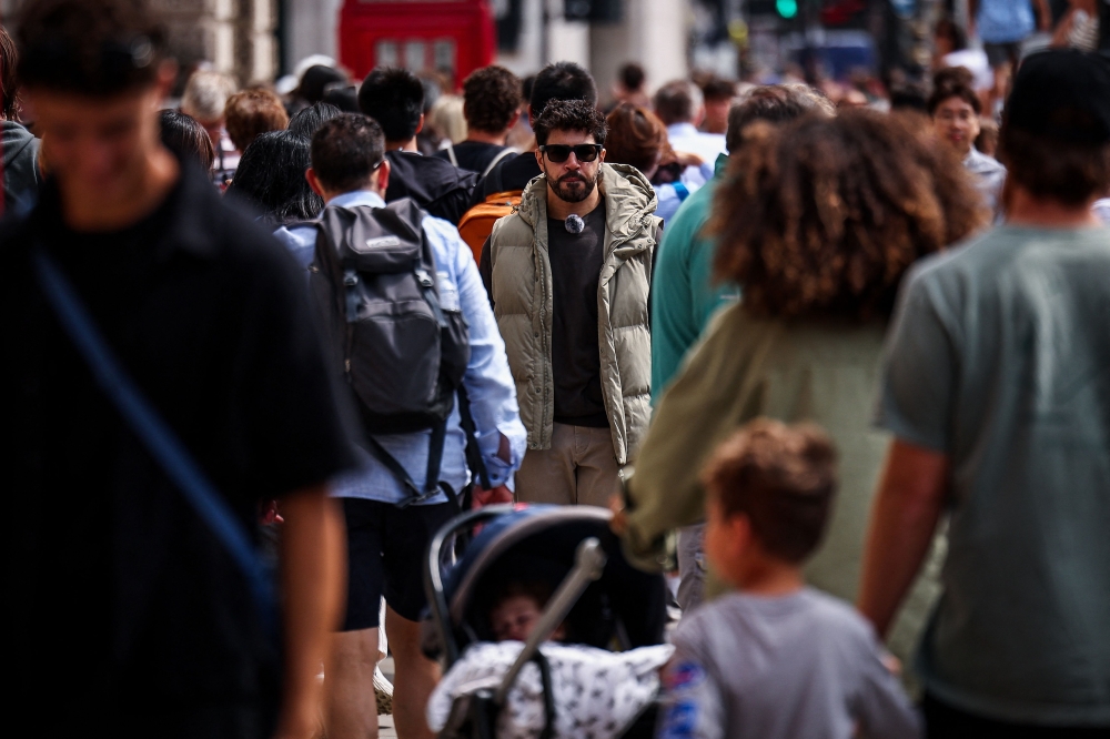 Diego Galdino on the hunt for pickpockets in central London, patrolling tourist hotspots for familiar suspects and telltale signs of thefts about to occur. — AFP pic