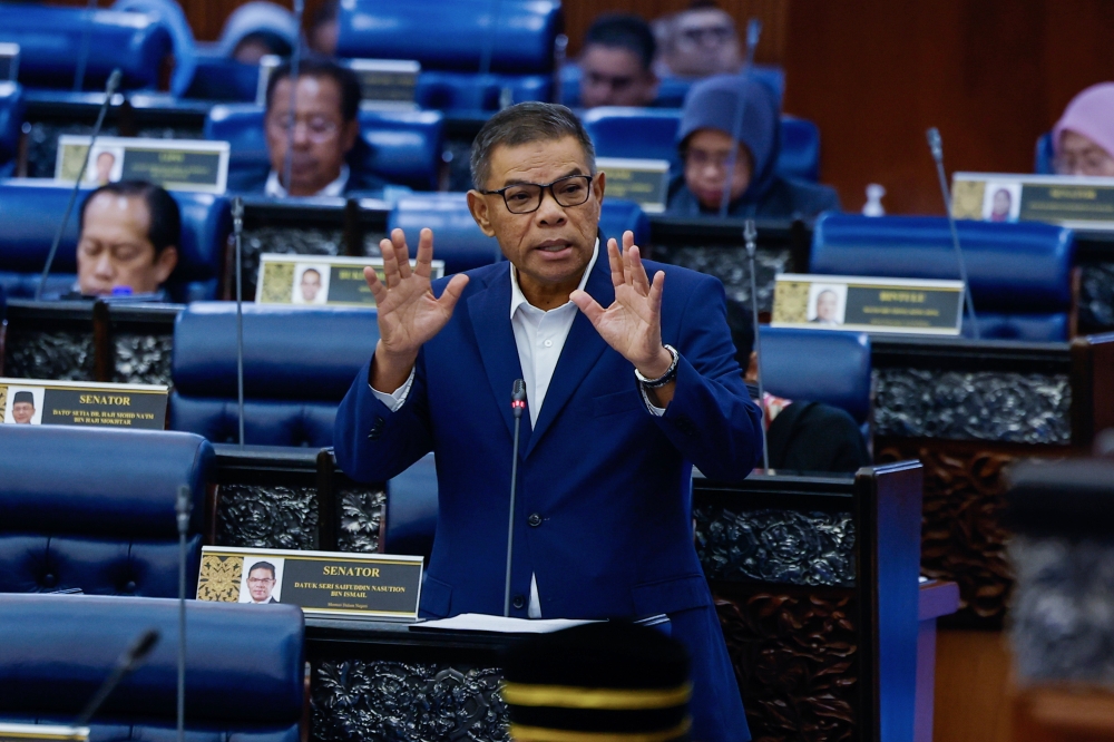 Home Minister Datuk Seri Saifuddin Nasution Ismail speaking in Parliament. — Bernama pic