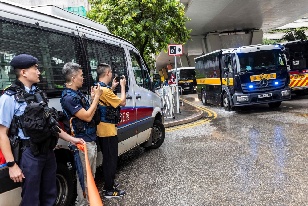 A Hong Kong Correctional Services vehicle carrying media mogul Jimmy Lai arrives at the West Kowloon court on August 18, 2025, for his national security trial. — AFP pic