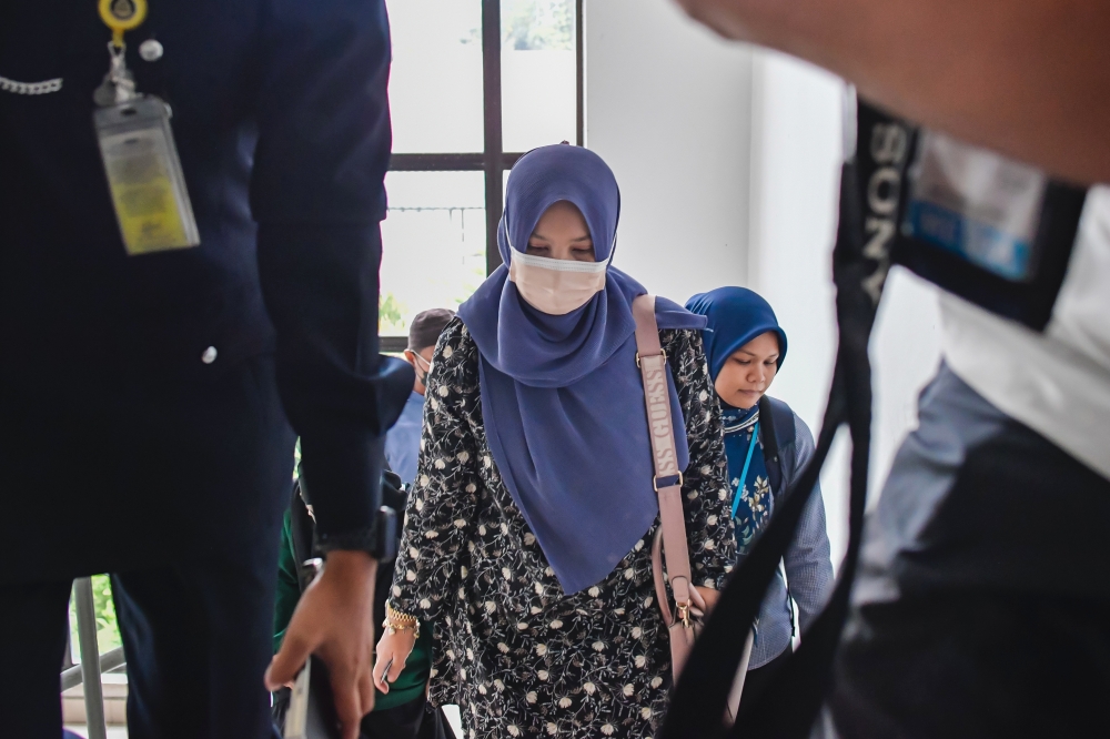 An English teacher at a school was charged in the Magistrates’ Court here today with causing public alarm by claiming that Zara Qairina Mahathir had been put into a washing machine. — Bernama pic