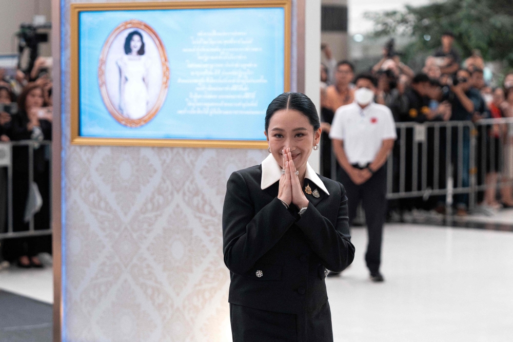 Thailand’s suspended Prime Minister Paetongtarn Shinawatra gestures as she leaves the Constitutional Court in Bangkok on August 21, 2025 amid an ouster attempt over her handling of the kingdom’s border row with Cambodia. — AFP pic