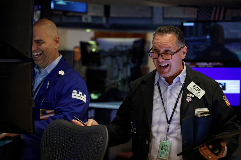 Traders work on the floor at the New York Stock Exchange (NYSE) in New York City on August 21, 2025. — Reuters pic