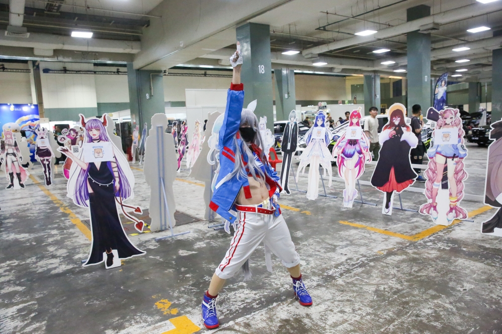 A cosplayer poses for a picture at the opening day of AniManGaki 2025 at the Mines International Exhibition and Convention Centre August 22, 2025. — Picture by Choo Choy May
