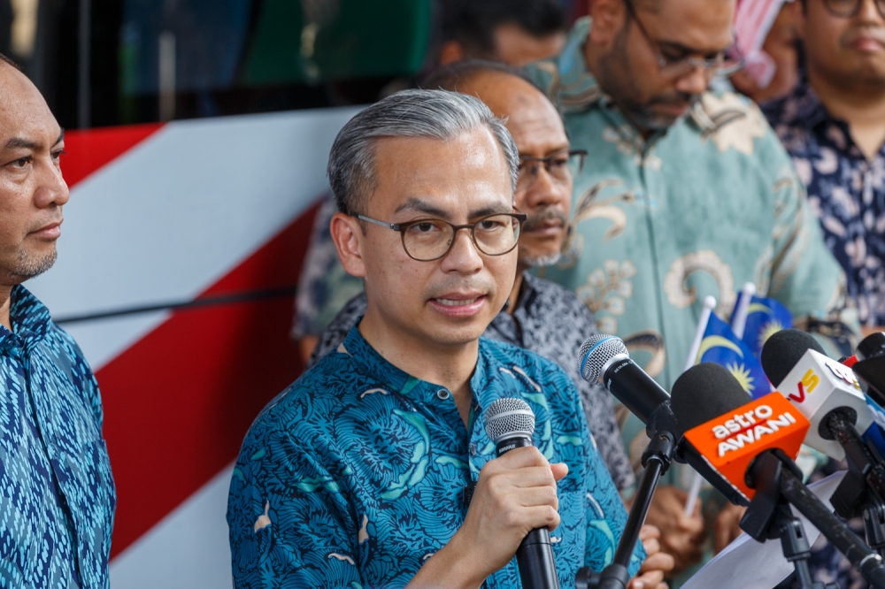 Communications Minister Datuk Fahmi Fadzil speaks at a press conference during a Jalur Gemilang distribution programme for National Day celebrations in Kuala Lumpur on August 23, 2025. — Picture by Raymond Manuel