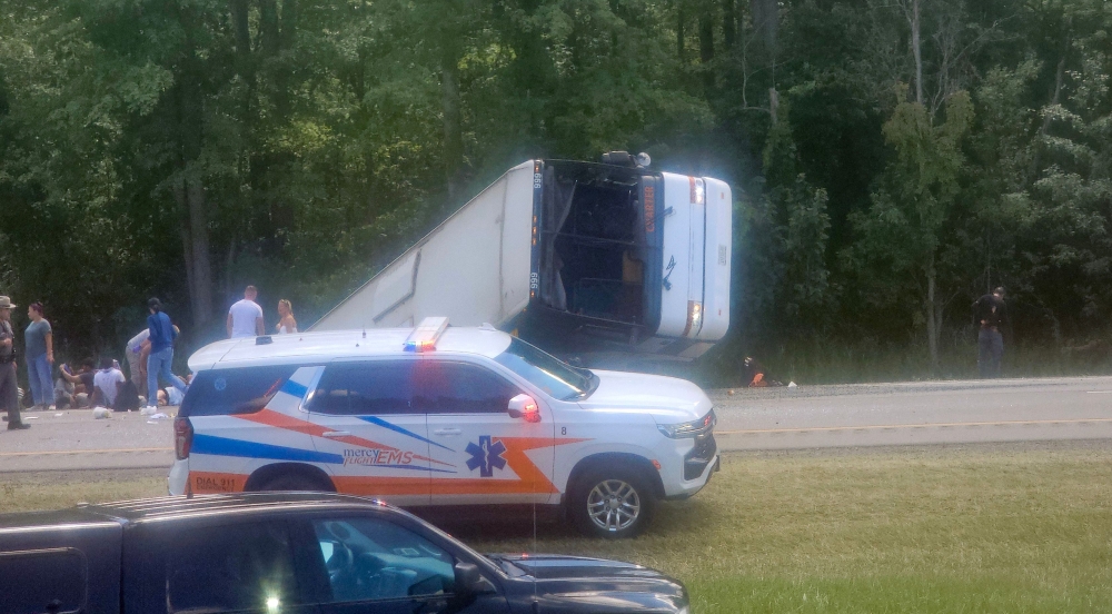 Victims and emergency personnel at the site of a bus crash on Interstate 90 eastbound near Pembroke, New York, on August 22, 2025 that killed five people, including a child. — Handout photo courtesy of Facebook user Mike Flaig via AFP