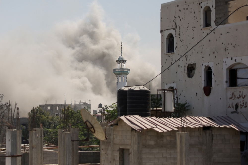 Smoke billows after an Israeli strike in Jabalia in the northern Gaza Strip on August 24, 2025. — AFP pic