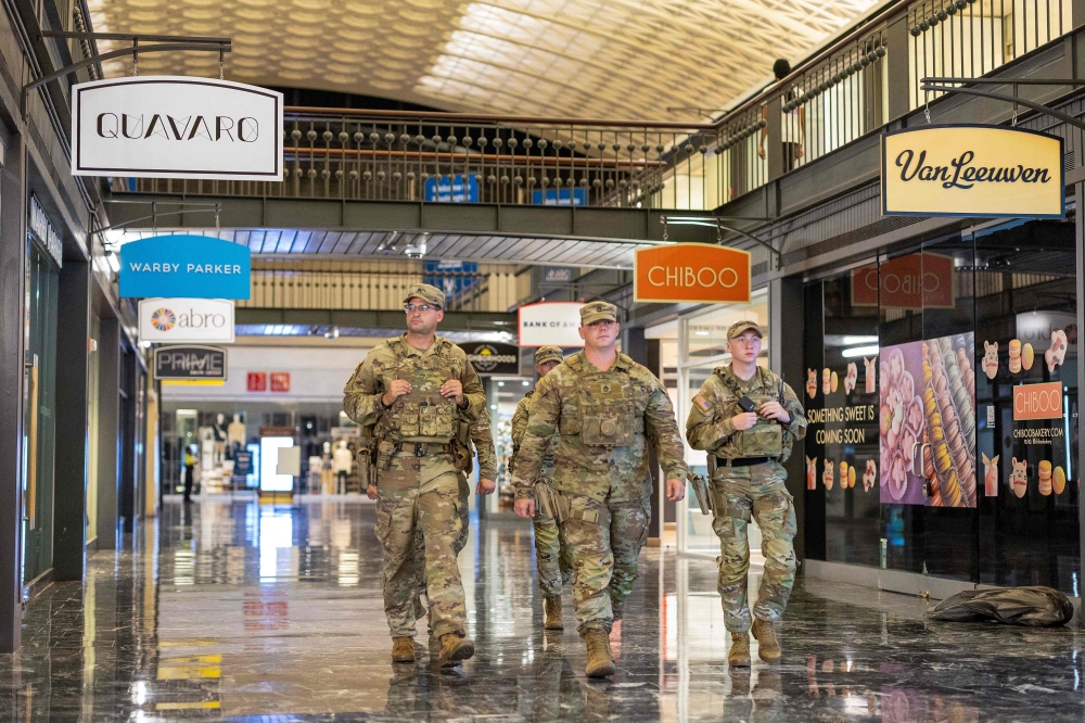 National Guard members patrol Union Station in Washington, DC on August 24, 2025, after President Donald Trump ordered federal officers to assist in crime prevention. — AFP pic